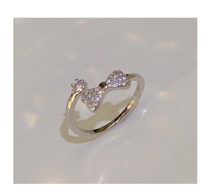 Close-up of S925 silver stamp on the inner band of the sparkling bow and crown ring