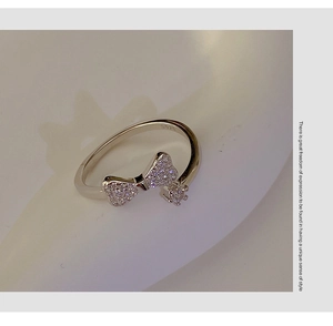 Close-up of S925 sterling silver bow ring featuring micro-pave cubic zirconia stones