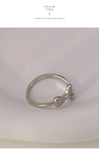 Close-up of S925 hallmark on silver bow ring with sparkling pave cubic zirconia