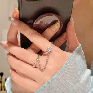 Detail of silver double chain ring with square zircon stone and adjustable open bands