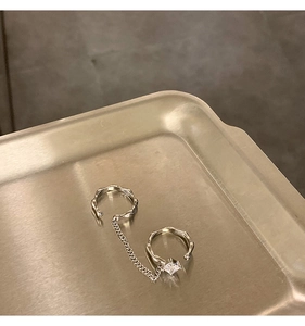 Macro detail of silver lava texture ring with chain link and square zircon stone