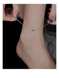 Detailed view of heart anklet featuring black onyx inlay and mixed chain design
