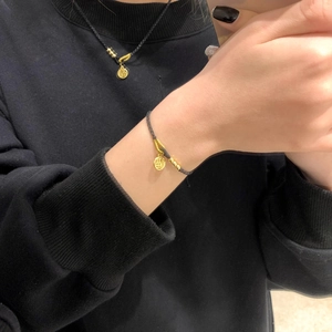 Black braided rope bracelet and necklace set with gold Fu character pendant charm