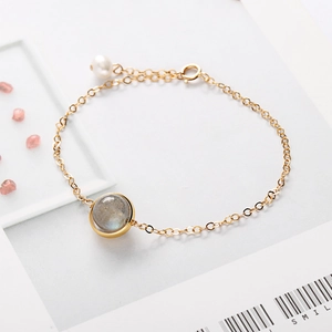 Elegant gold chain bracelet featuring labradorite stone and small pearl in a vintage design