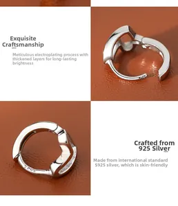 Close-up of S925 sterling silver heart earrings with stamped hallmark detail