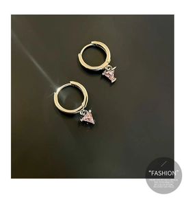 Detailed close-up of silver hoop earrings with triangular pink gemstone pendants