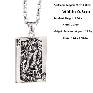 Detail of vintage King of Spades poker pendant in titanium steel with skull relief