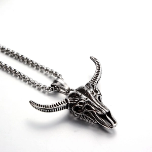 Detailed view of hip hop skull bull head pendant with retro silver oxidized texture