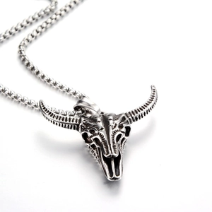 Retro bull skull pendant necklace in silver titanium steel on a polished white background