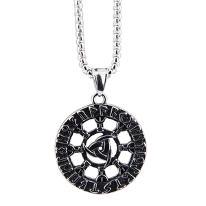 Detail shot of vintage stainless steel Viking rune pendant with Celtic knot engravings