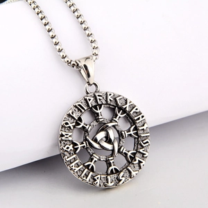 Macro shot of Viking Odin necklace with Nordic runes and silver Celtic knot pendant