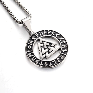 Close-up of vintage silver Valknut pendant with Runic engravings on box chain