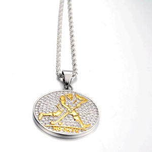 Detail of hockey player pendant with sparkling cubic zirconia and silver rope chain
