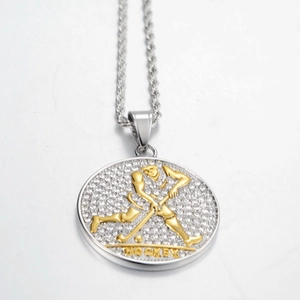 Close-up of hip hop hockey pendant with white rhinestones and silver rope chain