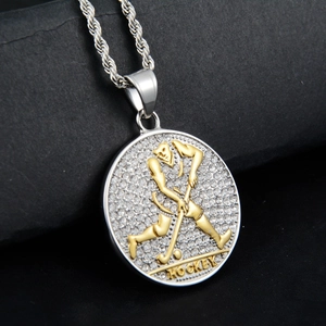 Detailed close-up of iced out hockey pendant with gold athlete and twisted chain