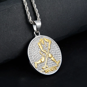 Detail of silver baseball pendant necklace with HOCKEY text and inlaid rhinestones
