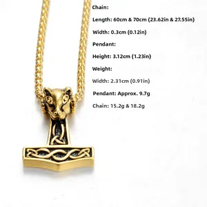 Detail of Viking Thor hammer Mjölnir pendant with golden goat head and Celtic knotwork