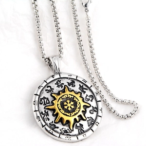 Detailed close-up of a silver zodiac pendant necklace with a golden sunburst center