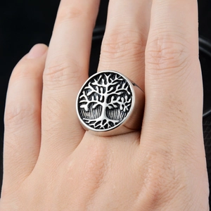 Vintage oxidized stainless steel Tree of Life signet ring for men on model's hand