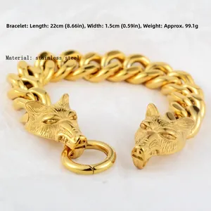 Vue détaillée du bracelet gourmette en acier inoxydable doré avec design double tête de loup