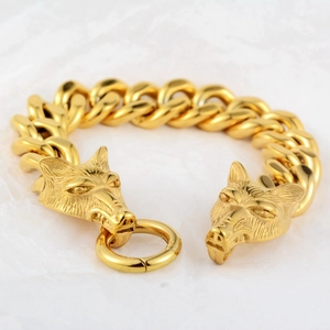 Bracelet gourmette doré en acier inoxydable avec doubles têtes de loup finement sculptées