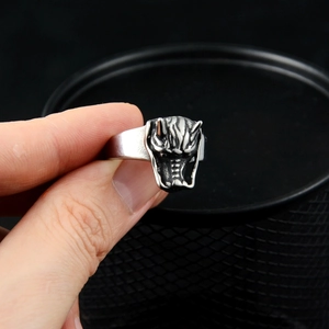 Vintage silver demon mask ring in titanium steel with detailed relief and antique finish