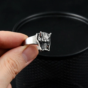 Macro shot of silver gothic dragon head ring with vintage matte finish and detailed relief