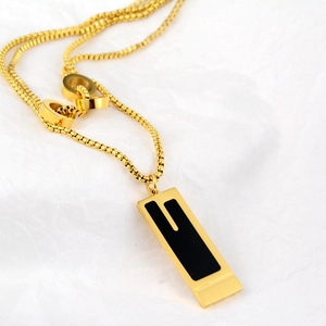 Modern gold titanium necklace featuring a black geometric rectangle pendant and box chain