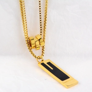 Minimalist titanium steel necklace featuring rectangular black pendant and gold beads