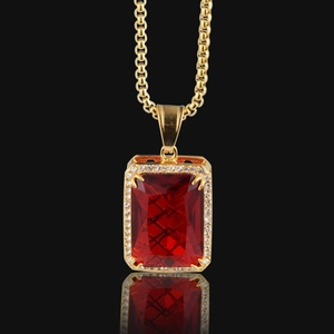Luxury gold hip hop pendant necklace with a large red rectangular ruby and diamonds