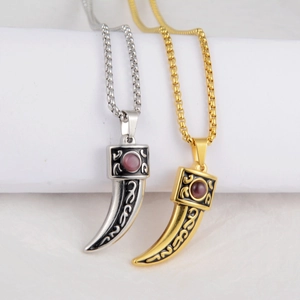 Hip hop style wolf tooth pendant necklace in gold and silver with red gemstones