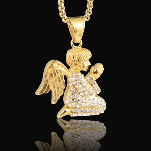 Hip hop angel pendant necklace with pavé crystals in gold tone on black background