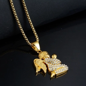 Macro detail of gold plated angel pendant with white cubic zirconia and fine box chain