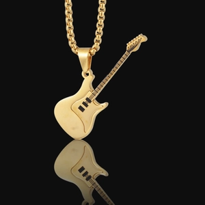 Polished gold guitar pendant necklace with black details and square link chain