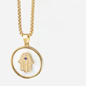 Detailed specs of the gold Hamsa pendant with dimensions and pearl inlay details