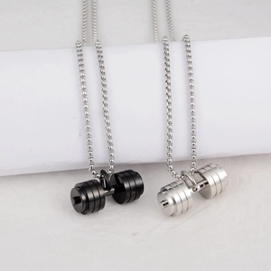Close-up of matte black and polished silver dumbbell pendants on bead chains