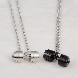 Detailed close-up of dumbbell pendants in silver and black finish on bead chains
