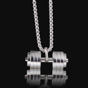 Silver stainless steel dumbbell pendant necklace on black background with reflection