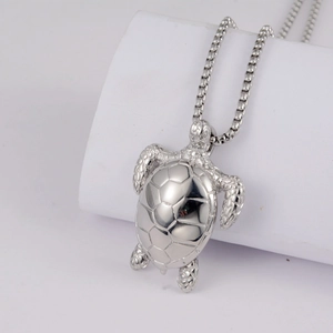 Detailed close-up of a silver sea turtle pendant featuring a geometric shell pattern
