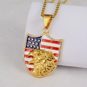Detailed view of golden eagle head shield pendant with US flag design and rhinestones