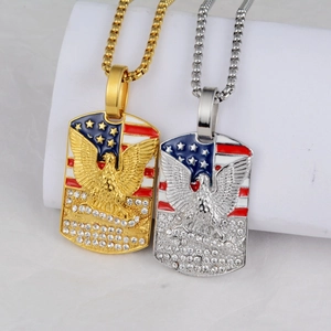 Detailed close-up of eagle dog tag pendants with American flag and sparkling rhinestones