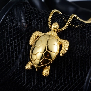 Hip hop turtle pendant necklace in gold finish with box chain on dark mesh