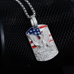 Macro detail of stainless steel eagle army tag pendant with American flag and crystals