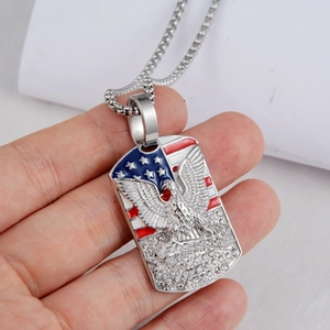 Detailed view of stainless steel eagle dog tag pendant with American flag and crystals
