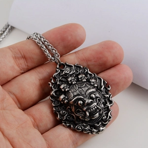 Vintage silver lion mask necklace pendant with skull details for men in retro style