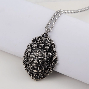Retro lion head pendant necklace with gothic skull design in antique silver finish