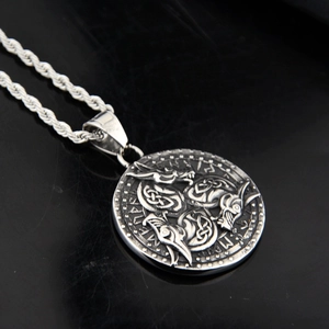 Vintage Viking crow medallion necklace in stainless steel with nordic rune carvings