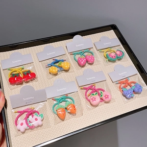 Colorful fruit and flower children hair ties set including strawberry and carrot shapes