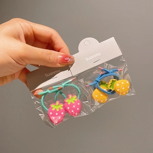 Set of colorful kids' elastic hair ties with 3D strawberry and pineapple fruit charms