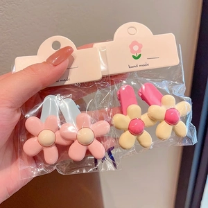Macaron color flower hair clips set for girls featuring pink and cream yellow floral designs